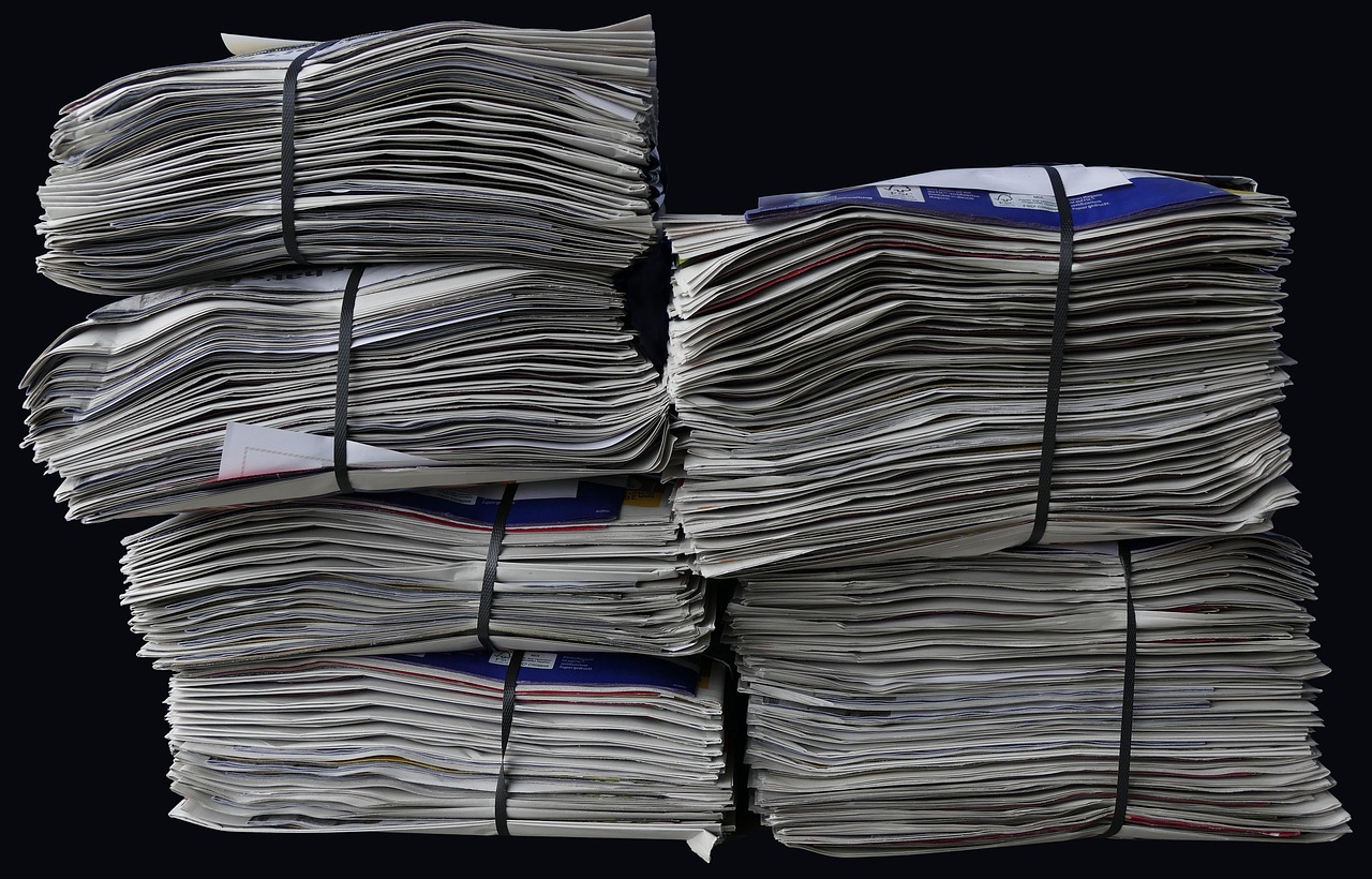 newspapers brochures stack 2586621